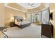 Bright bedroom with decorative ceiling, windows, and soft carpet flooring at 13214 Mink Ln, Carmel, IN 46074