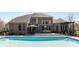 Stunning backyard with pool, deck, and outdoor seating area at 13214 Mink Ln, Carmel, IN 46074