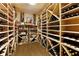 Extensive wine cellar with wooden racks showcasing an impressive collection at 13214 Mink Ln, Carmel, IN 46074