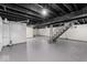 Spacious basement with painted floor and exposed ceiling, bright lighting at 1331 W 33Rd St, Indianapolis, IN 46208