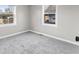 Bedroom featuring two windows and gray carpet at 1331 W 33Rd St, Indianapolis, IN 46208