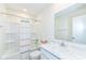 Bright bathroom with shower-tub combination, marble countertop, and mirror at 1455 Bigleaf Dr, Sheridan, IN 46069