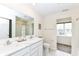 Well-lit bathroom features a double vanity, tile floors, and a shower-tub combination at 1455 Bigleaf Dr, Sheridan, IN 46069