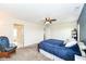 Comfortable bedroom with a ceiling fan, neutral walls and carpeted floor at 1455 Bigleaf Dr, Sheridan, IN 46069