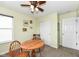 Cozy dining area with wood table, ceiling fan, and closet storage at 1455 Bigleaf Dr, Sheridan, IN 46069