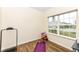 Small exercise room with treadmill, yoga mat, and storage for gear near a window overlooking front yard at 1455 Bigleaf Dr, Sheridan, IN 46069
