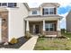 Charming home exterior with covered front porch, manicured lawn, tasteful landscaping, and a welcoming front door at 1455 Bigleaf Dr, Sheridan, IN 46069