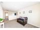 Cozy loft area with neutral walls and carpet, perfect for relaxing or entertaining at 1455 Bigleaf Dr, Sheridan, IN 46069