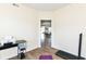Office with laminate flooring, neutral walls, and a view into dining room with table and chairs at 1455 Bigleaf Dr, Sheridan, IN 46069