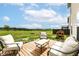Back patio with lounge seating and large fenced in yard at 1455 Bigleaf Dr, Sheridan, IN 46069