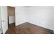 Bright bedroom featuring neutral paint and dark hardwood-style flooring at 15398 Border Dr, Noblesville, IN 46060