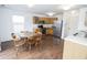 Bright kitchen with stainless steel appliances, wooden cabinets, and adjacent dining area at 15398 Border Dr, Noblesville, IN 46060
