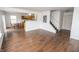 Open-concept living room showcasing wood laminate floors and access to the dining area at 15398 Border Dr, Noblesville, IN 46060