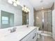 Bathroom featuring a double vanity, tile floors and a tiled shower with glass doors at 159 Derringer Ave, Westfield, IN 46074