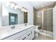 Bathroom featuring a double vanity, tile floors and a tiled shower with glass doors at 159 Derringer Ave, Westfield, IN 46074