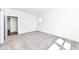 A carpeted bedroom with a large window looking to the outside, allowing natural light at 159 Derringer Ave, Westfield, IN 46074