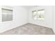 Minimalist bedroom with neutral carpet, white walls, and natural light from two windows at 159 Derringer Ave, Westfield, IN 46074