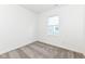 Neutral bedroom showcasing gray carpet, a window letting in natural light, and white walls at 159 Derringer Ave, Westfield, IN 46074
