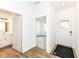 Bright entryway featuring wood-look flooring, a white front door, and access to a bathroom and bedroom at 159 Derringer Ave, Westfield, IN 46074