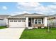 Charming single-story home featuring a two-car garage, landscaped front yard, and neutral-tone exterior at 159 Derringer Ave, Westfield, IN 46074