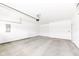 Spacious garage with painted concrete floor and door leading to the interior of the home at 159 Derringer Ave, Westfield, IN 46074