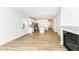 Bright living space featuring a fireplace, hardwood floors and a kitchen with stainless steel appliances at 159 Derringer Ave, Westfield, IN 46074