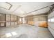 Spacious garage with storage cabinets, overhead lighting, and an automatic door opener at 1611 Orchard Ln, Anderson, IN 46011