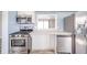Modern kitchen with stainless steel appliances and light blue walls at 1611 Orchard Ln, Anderson, IN 46011