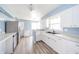 Updated kitchen with white cabinets and stainless steel appliances at 1611 Orchard Ln, Anderson, IN 46011