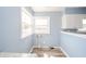 Bright Kitchen with views of the property through the windows at 1611 Orchard Ln, Anderson, IN 46011