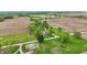 Expansive farm setting showcases the brick residence with a red barn and surrounding farmlands at 1901 S Old State Road 67, Paragon, IN 46166