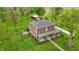 Stunning aerial view of a red brick home, red barn, and lush green surroundings at 1901 S Old State Road 67, Paragon, IN 46166