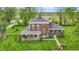 Aerial view of a beautiful brick home featuring lush lawn, brick walkway and manicured flowerbeds at 1901 S Old State Road 67, Paragon, IN 46166