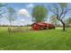 Backyard shed with an American flag, signage and greenery at 1901 S Old State Road 67, Paragon, IN 46166
