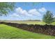 Backyard featuring a wood pile for firewood and a meadow in the background at 1901 S Old State Road 67, Paragon, IN 46166