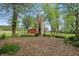 Backyard featuring a silo, red barn and a view of the house at 1901 S Old State Road 67, Paragon, IN 46166