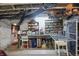 Basement room featuring shelves full of glassware and baskets, a workspace, and concrete floors at 1901 S Old State Road 67, Paragon, IN 46166