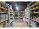Basement storage room showcasing rows of shelves filled with various food supplies, containers, and ample storage solutions at 1901 S Old State Road 67, Paragon, IN 46166