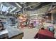 Basement storage area with ample shelving filled with organized containers and various household items on carpeted floors at 1901 S Old State Road 67, Paragon, IN 46166