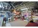 Basement storage area with ample shelving filled with organized containers and various household items on carpeted floors at 1901 S Old State Road 67, Paragon, IN 46166