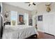 Spacious bedroom features hardwood floors, natural light, and deer decor at 1901 S Old State Road 67, Paragon, IN 46166