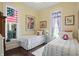 Cozy bedroom featuring twin beds, bright windows, and vintage decor at 1901 S Old State Road 67, Paragon, IN 46166