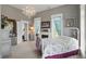 Bright bedroom featuring soft carpet, classic decor, and a chandelier at 1901 S Old State Road 67, Paragon, IN 46166
