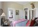 Warm bedroom with a queen bed, deer head art, and doorways to other rooms at 1901 S Old State Road 67, Paragon, IN 46166