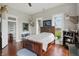 Well-lit bedroom features hardwood floors and decor at 1901 S Old State Road 67, Paragon, IN 46166