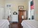 Inviting bedroom with twin beds, wooden armoire, and stained glass window accents at 1901 S Old State Road 67, Paragon, IN 46166