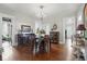 Elegant dining room featuring a chandelier, hardwood floors, and detailed trim at 1901 S Old State Road 67, Paragon, IN 46166