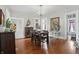 Charming dining room featuring hardwood floors, ornate chandelier, and bright, airy feel at 1901 S Old State Road 67, Paragon, IN 46166