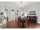 Elegant dining room with hardwood floors, decorative stained glass, and classic chandelier at 1901 S Old State Road 67, Paragon, IN 46166