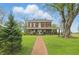 Beautiful two-story brick home with a charming front porch and manicured lawn at 1901 S Old State Road 67, Paragon, IN 46166